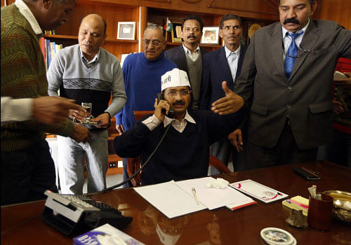 File photo of Aam Aadmi Party leader Arvind Kejriwal assumimg the office of the Chief Minister of Delhi in New Delhi. AP