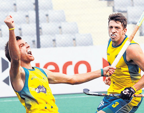 The saviour: Australia's Jacob Whetton (left) celebrates with Simon Orchard after scoring the winner against Belgium in their World League Final match on Friday.
