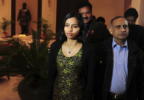 Indian diplomat Devyani Khobragade walks with her father Uttam Khobragade (R) upon her arrival at Maharashtra Sadan state guesthouse in New Delhi January 10, 2014. The U.S. said on Friday it would withdraw one of its diplomats from New Delhi at India's request after Washington effectively expelled Khobragade, the Indian envoy at the centre of a dispute between the allies. Khobragade, 39, who was India's deputy consul-general in New York, was arrested in December on charges of visa fraud and lying to U.S. authorities about what she paid her housekeeper. Khobragade's arrest and subsequent strip-search enraged New Delhi, led to protests and dealt a serious blow to U.S. efforts to strengthen ties with India. Picture taken January 10, 2014. REUTERS