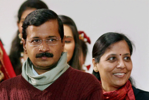 Chief Minister Arvind Kejriwal with his wife Sunita at the NCC Republic Day Parade Camp 2014, in New Delhi on Wednesday.PTI Photo
