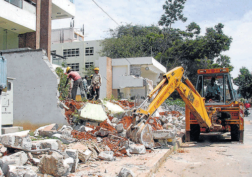 Properties are demolished for road-widening but, without cash compensation.