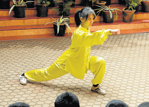 From Japan: Wushu Tai-Chi Japanese Instructor Haruka Ito demonstrates a technique to the students of Gonzaga school in Mangalore on Saturday.