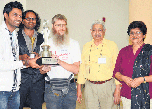 Nigel Richards (centre), winner of the 10th edition of the  International Scrabble Tournament on Sunday, is seen with M S Murali, senior manager (employee engagement), iGATE Global Solutions, and Rex D'Souza and Radhika Mahalingaiah of Karnataka State Scrabble Association.