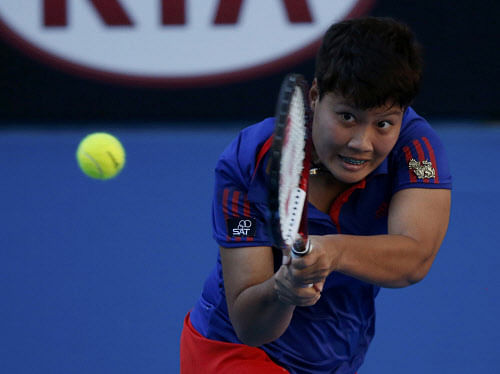 Luksika Kumkhum of Thailand hits a return to Petra Kvitova of the Czech Republic during their women's singles match at the Australian Open 2014 tennis tournament in Melbourne. Reuters Photo