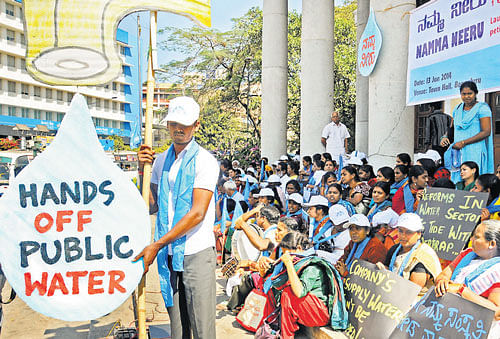 it's a right: Volunteers take part in the campaign against  privatisation of water in Bangalore on Monday. dh photo