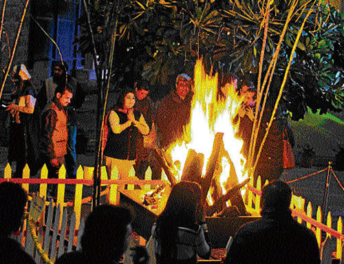 People enjoy a bonfire. DHNS