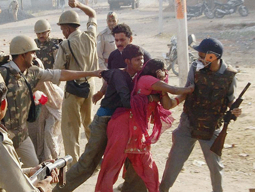 In an incident of police brutality, policemen allegedly slapped and cane-charged a group of women protesting on the national highway here against the death of two persons in a mishap. PTI photo for representation only