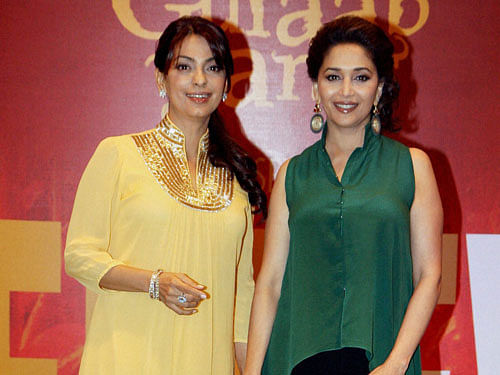 ollywood actresses Madhuri Dixit and Juhi Chawla during an event. PTI File Image