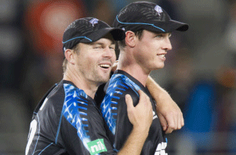 New Zealand's Adam Milne and Colin Munro celebrate defeating the West Indies in the Twenty-20 International Cricket Match at Eden Park in Auckland, New Zealand, Saturday, Jan. 11, 2014. AP photo
