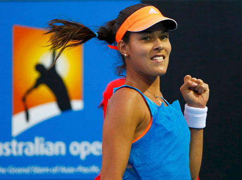 Ana Ivanovic of Serbia celebrates a point during her women's singles match against Annika Beck of Germany at the Australian Open 2014 tennis tournament in Melbourne January 15, 2014. REUTERS