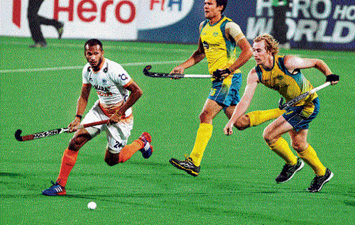 tough run: India's SV Sunil (left) chases a ball during the World League&#8200;Final match against Australia on&#8200;Wednesday. pti