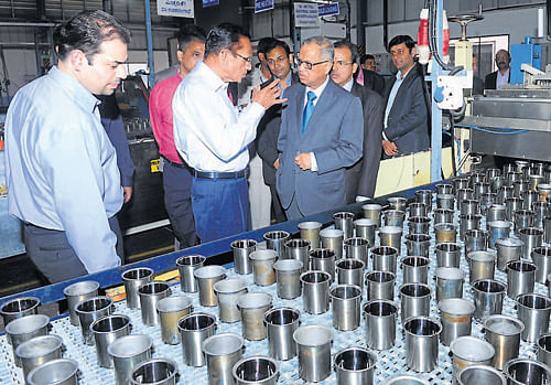 Infosys Executive Chairman Dr N R Narayana Murthy having a look at the facility at Primacy industries after inaugurating the same at Baikampady in Mangalore on Wednesday. Primacy industries Chairman T Gautham Pai among others look on. DH photo