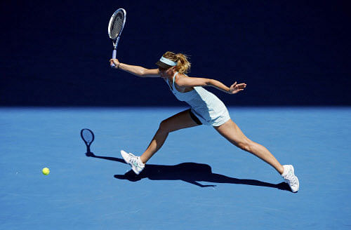 Maria Sharapova of Russia hits a return to Karin Knapp of Italy during their women's singles match at the Australian Open 2014 tennis tournament in Melbourne January 16, 2014. REUTERS