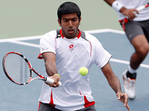 Seventh seeded Indo-Pak pair of Rohan Bopanna and Aisam-Ul-Haq Qureshi fought hard to win in the men's doubles first round of the Australian Open here Thursday while Sania Mirza and her Zimbabwean partner Cara Black strolled to victory in the women's doubles. Reuters file photo of Rohan Bopanna
