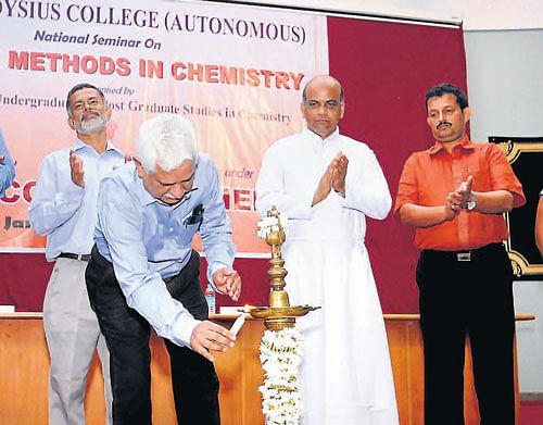 IISC (Bangalore) Honorary Professor Dr Srinivasan Chandrasekharan lights a lamp to inaugurate a two-day national seminar on 'Modern methods in chemistry,' organised by Department of Chemistry, St Aloysius college in Mangalore on Thursday.