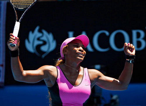 Serena Williams of the U.S. celebrates defeating Daniela Hantuchova of Slovakia in their women's singles match at the Australian Open 2014 tennis tournament in Melbourne January 17, 2014. REUTERS