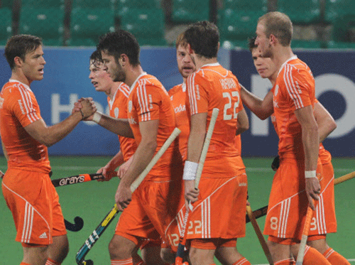 Netherlands players celebrate a goal against Australia in the World Hockey League semifinal. PTI