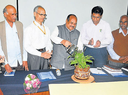Benefit: Chairman of National Safai Karmachari&#8200;Commission M&#8200;Shivanna waters a sapling marking the inauguration of workshop on prohibition of manual scavenging, at ZP hall in Mysore on Friday. (&#8200;L-R) Faculty of State Institute for Urban Development (SIUD) Deepa N, resource person Malleshappa, Director of SIUD Venkatesh Kadagada Kai, Nodal Officer Sriprakash are seen. dh photo