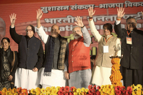 BJP PM candidate Narendra Modi, party President Rajnath Singh, senior leaders LK Advani, Sushma Swaraj, MP Chief Minister Shivraj Singh Chouhan and Chhattisgarh CM Raman Singh wave at delegates during BJP National Council Meet in New Delhi on Saturday. PTI Photo