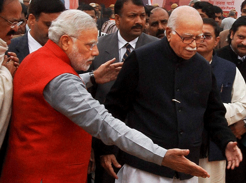 Senior BJP leader L K Advani, who had initially opposed naming of Narendra Modi as PM candidate, today showered praise on him but cautioned against ''over confidence'' which had spoiled the party's chance of retaining power in 2004. PTI photo