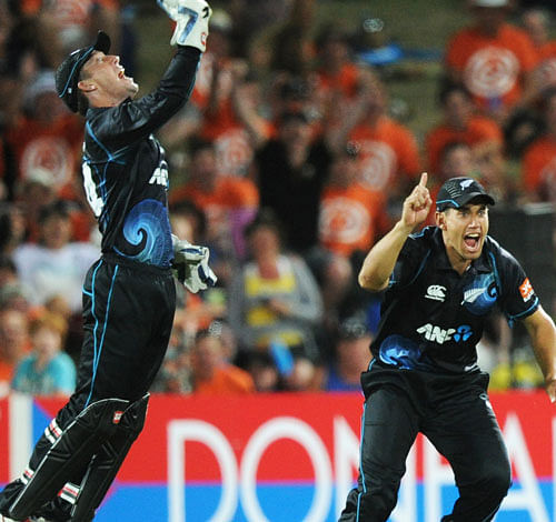 Original: Nathan McCullum, Ross Taylor New Zealand's Luke Ronchi, left, celebrates with teammate Ross Taylor after taking the catch to dismiss India's Ravindra Jadeja for 0 in their first one day international cricket match at McLean Park in Napier, New Zealand, Sunday, Jan. 19, 2014. (AP Photo