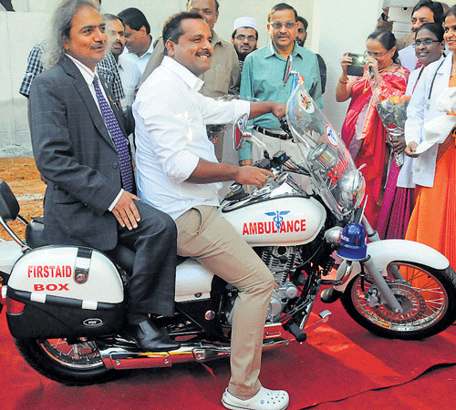 Health and Family Welfare Minister U T Khader launches the two-wheeler metro ambulance in Bangalore on Sunday.  Principal Secretary, Department of Health and Family Welfare, M Madan Gopal is with him. DH Photo
