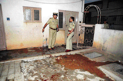 collecting clues: Police inspect the scene of crime at Hoysalanagar in Sunkadakatte where a woman was stabbed to death by her neighbour on Sunday. dh photo