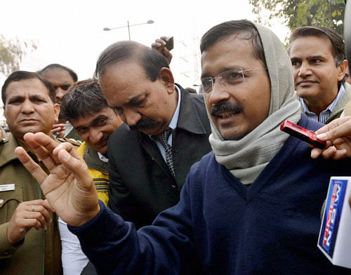In an unprecedented action, Delhi Chief Minister Arvind Kejriwal and his ministers today began a dharna outside Rail Bhavan demanding action against police officials who refused to carry out a raid on an alleged drug and prostitution racket in South Delhi last week. PTI