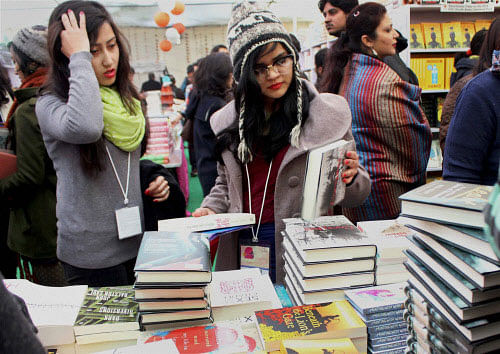 Visitors browsing through books during the ongoing Jaipur Literature Festival in Jaipur. PTI Photo