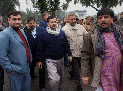Delhi Chief Minister Arvind Kejriwal along with AAP leaders Sanjay Singh, Ashutosh and other heading for a meeting on the second day of their dharna against police near Rail Bhavan in New Delhi on Tuesday. PTI Photo