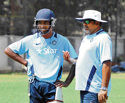 Attentive: Under-19 coach Bharat Arun (right) discusses a point with Sanju Samson on Tuesday. dh photo