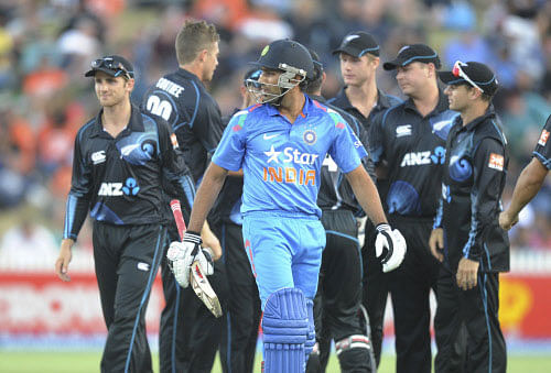 Rohit Sharma looks back after being dismissed by New Zealand's Tim Southee for 20 in the second one day International cricket match at Seddon Park in Hamilton, New Zealand, Wednesday, Jan. 22, 2014. AP Photo