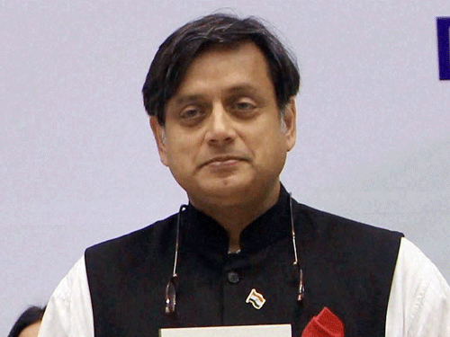 NCP today said Union minister Shashi Tharoor should 'himself disassociate' from his ministerial responsibilities till the investigations in the death of his wife Sunanda Pushkar are over. PTI File Photo