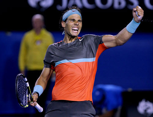 Rafael Nadal of Spain celebrates after defeating Roger Federer of Switzerland during their semifinal at the Australian Open tennis championship in Melbourne, Australia, Friday, Jan. 24, 2014. AP Photo