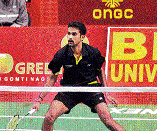poised to strike India's Aditya Prakash during his  quarterfinal win over Xeu Song of China on Friday.