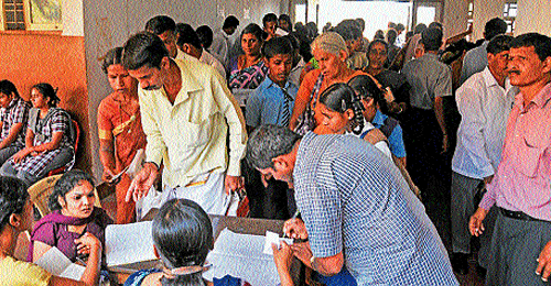 for a better tomorrow: Persons with disabilities register their names at the camp venue at Artificial Limb Centre at Wenlock Hospital in Mangalore DH Photo