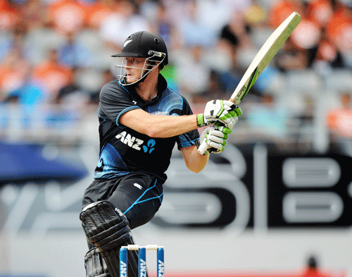 New Zealand's Martin Guptill bats against India on his way to 111 in the third one-day International cricket match at Eden Park in Auckland, New Zealand, Saturday, Jan. 25, 2014. AP