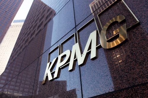 The street level sign of the KPMG buliding in downtown Los Angeles is shown in this file photo from April 10, 2013. Chinese units of the global 'Big Four' accounting firms -- KPMG, Deloitte & Touche, PricewaterhouseCoopers and Ernst and Young -- should be suspended from auditing U.S.-listed companies for six months, a judge in the United States ruled January 23, 2014, in an escalation in a long-running dispute over regulators' access to documents. REUTERS