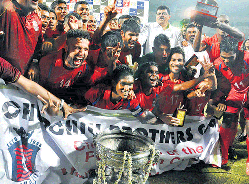 ecstatic The Churchill Brothers team celebrates after winning its first ever Federation Cup title on Saturday.