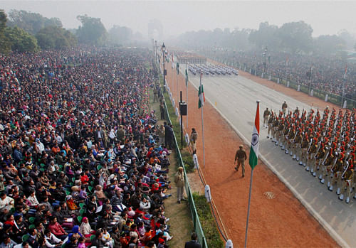 Marching contingents at the 65th Republic Day parade at Rajpath in New Delhi on Sunday. PTI Photo