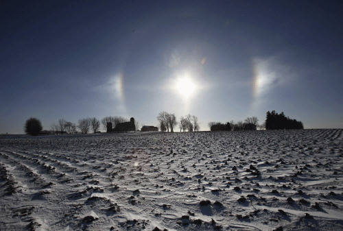 A 'sun dog' atmospheric phenomenon appears over a farm in southern Minnesota. Reuters