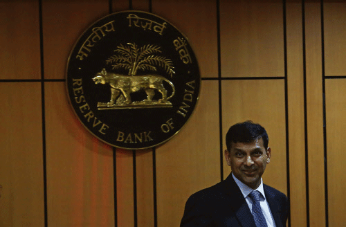 File picture shows Rajan, RBI governor, arriving at a news conference in Mumbai. Reuters