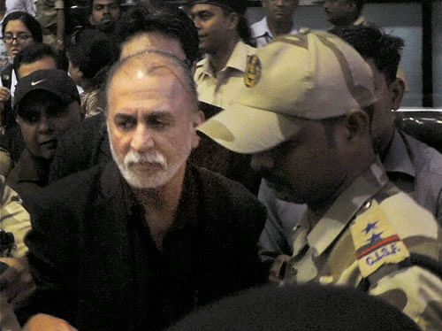 The lady investigating officer in the sexual assault case against journalist Tarun Tejpal has filed a complaint that he had threatened her during the probe. PTI file photo