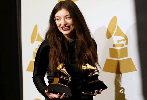 Pop singer Lorde poses backstage with her awards for song of the year for 'Royals' and best pop solo performance for 'Royals' at the 56th annual Grammy Awards in Los Angeles, California January 26, 2014. REUTERS