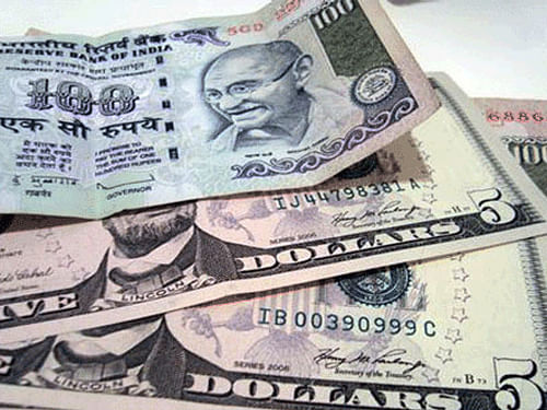The rupee today depreciated by 15 paise versus the dollar to end at 62.56, its first drop in three sessions, in line with a sell-off in emerging markets after US Federal Reserve scaled back its stimulus programme. PTI File Photo