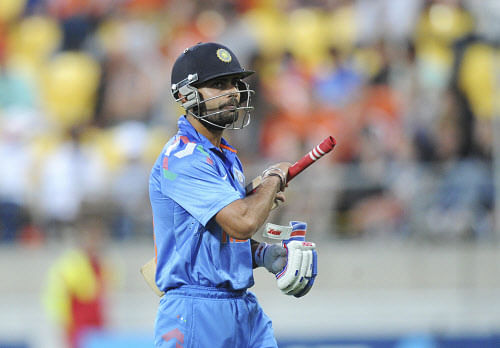 Virat Kohli walks, out for 82 off the bowling of New Zealand's Nathan McCullum during the fifth one day International cricket match at Westpac Stadium in Wellington, New Zealand, Friday, Jan. 31, 2014. AP Photo