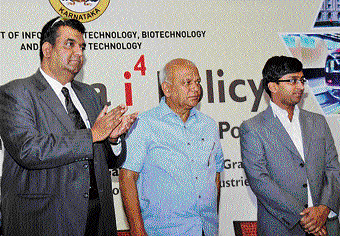 Secretary, Dept of IT, BT and Science & Technology, GoK, Srivatsa Krishna (extreme left), state Minister for IT, BT, Science & Technology S R Patil (centre) and Director, IT & BT, S S Nakul at the announcement of policies for the electronics and IT sectors in Bangalore on Friday. DH PHOTO