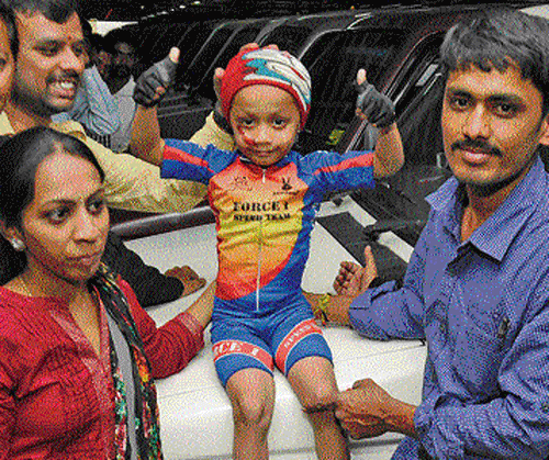 Gagan with his parents Satish and Hema, after achieving the feat in the City on Friday. DH Photo