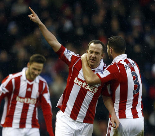 man of the moment: Stoke City's Charlie Adam (centre) celebrates with a team-mate after scoring against Manchester United on Saturday. Reuters Photo