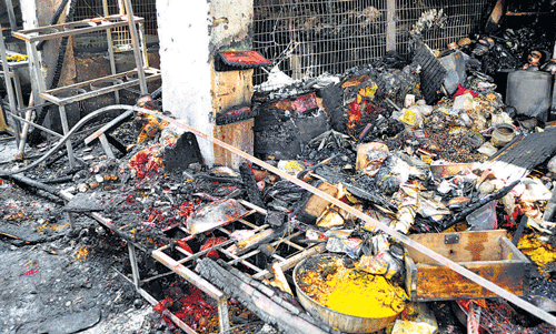 nothing to salvage: Shops gutted in a fire mishap at  KR Puram market . dh Photo